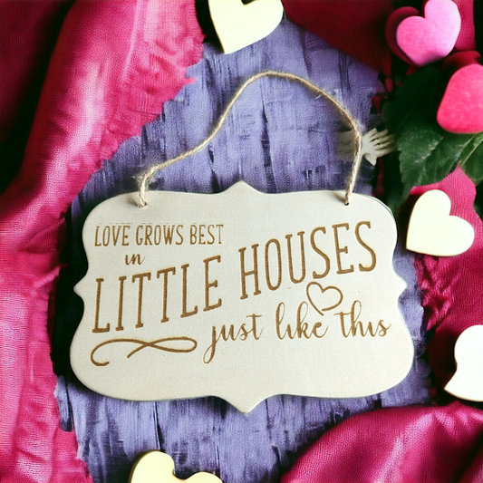 Love grows best in Little Houses sign
